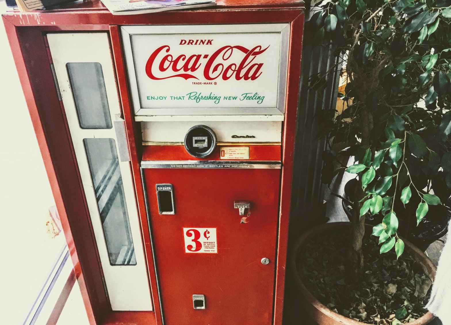 red and white coca cola vending machine